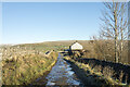 NY8538 : Icy road passing Slack House by Trevor Littlewood