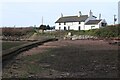 SM8703 : Shore of bay in front of The Old Point House by M J Roscoe