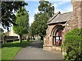 NY3650 : Path beside the church by Adrian Taylor