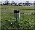 ST3099 : Yellow text on a green litter bin, New Inn, Torfaen by Jaggery