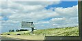 TL2368 : Ox-eye daisies at the side of the A14 by Christopher Hilton