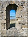 NU2409 : Aln estuary viewed through the Mortuary Chapel window by Oliver Dixon