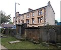 NS5669 : Tenement and gravestones by Richard Sutcliffe