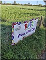 SO6521 : Outdated banner alongside the A40, Lea, Herefordshire by Jaggery