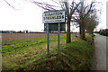 TG2221 : Stratton Strawless Village Name sign by Geographer