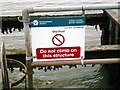 TQ9692 : Old Pool sluice sign by John Myers