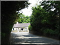 SH5968 : Cottage opposite Eglwys Y Santes Fair (St Mary's Church), Tregarth by Eric Jones