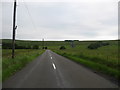  : Country road near West Woodburn by James Denham