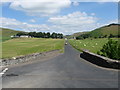 NT1642 : The road to Romanno Bridge leading off the A72 by James Denham