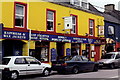 Q4401 : Dingle Town - Bright yellow store & restaurant by Joseph Mischyshyn