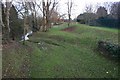 SP2755 : Flood defence banks alongside the River Dene by David P Howard