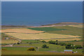 SH5809 : Hay fields by the sea by Nigel Brown