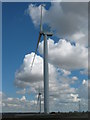 TQ9721 : Working and non-working Wind turbine of Little Cheyne Court Wind Farm by David Anstiss