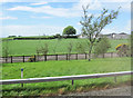 NY1676 : Mainhill Farm from A74(M) northbound by John Firth