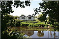 SJ4056 : Chalet on the River Dee by Jeff Buck