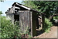 TG2820 : Disused track maintenance hut near Tunstead Road bridge by Glen Denny