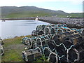 NL6397 : Creels by the Vatersay Causeway by Colin Smith