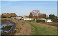 TL9103 : River defence, embankment, caravan park by Roger Jones