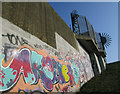 TQ5646 : Graffiti on the Flood Barrier by Dave Croker