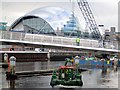 NZ2563 : Clearwater manoeuvres below the Gateshead Millennium Bridge by Andrew Curtis