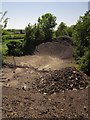 ST0411 : Gravel heaps on the former A38 by Derek Harper