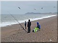 TG0844 : Sea anglers on Salthouse Beach by Oliver Dixon