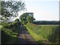 NU0040 : Country road near Lowick by Graham Robson