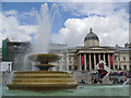 TQ2980 : Fountain and Olympic countdown clock in Trafalgar Square by Graham Robson