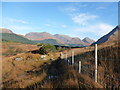 NN1346 : Muddy path by the deer fence, Glen Etive by Alan O'Dowd