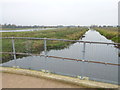 TL2698 : The Bathing Bridge over Morton's Leam - The Nene Washes by Richard Humphrey