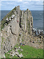 NJ5268 : Rock climbing at Logie Head by Doug Lee