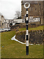 NY7146 : Alston Signpost by David Dixon