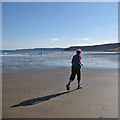 TA0488 : Lone jogger on the beach by Pauline E