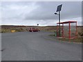 HU3277 : Bus shelter and car park at the Hillswick junction by Oliver Dixon