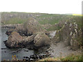 NT9564 : Jagged rocks at Ramfauds by Graham Robson