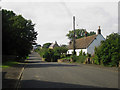 NT9941 : Road through Bowsden by Graham Robson