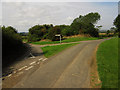 NT9741 : Country road junction near Woodside Farm by Graham Robson