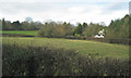 SP1872 : Field and a house by Rising Lane north of Kingswood by Robin Stott