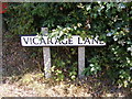 TM3589 : Vicarage Lane sign by Geographer