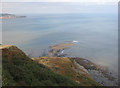 NZ9802 : Rocky shore from the hotel gardens by Pauline E