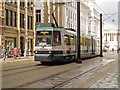 SJ8498 : Metrolink Tram on Moseley Street by David Dixon