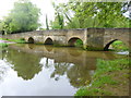 SP8982 : Geddington, roadbridge by Mike Faherty