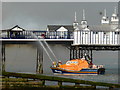 TV6198 : RNLI Lifeboat fire fighting at Eastbourne Pier by PAUL FARMER