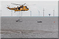 TM1714 : RNLI Volunteer in  Water, Clacton, Essex by Christine Matthews