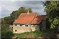 SO9826 : The old St. Peter's church on Cleeve Hill by Roger Davies