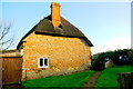 SY4296 : Stone and Thatch Cottage at Denhay by Nigel Mykura