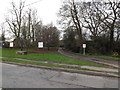 TL3758 : House entrance & Hardwick Village sign by Geographer