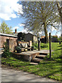 TM3372 : Heveningham Village Pump & footpath sign by Geographer