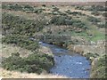 NY2218 : Footbridge crossing Newlands Beck by Graham Robson