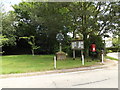 TM1570 : Church Street Postbox, Notice Board & Village sign by Geographer